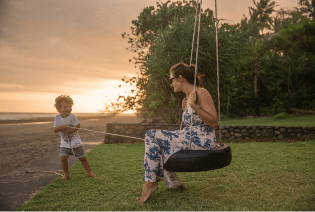 A mom confidently having fun with her son after choosing the right deodorant