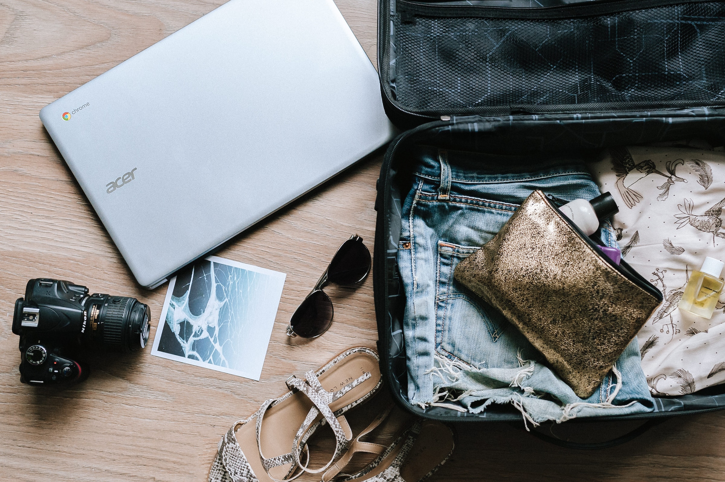 travel essentials for women in a suitcase